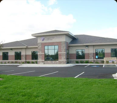 Finished commercial building with a brick-and-stone exterior, built by Powerbuilt Construction